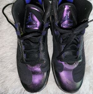 Air Jordan's, boys size 5.5 black with an iridescent purple trim (pictured)